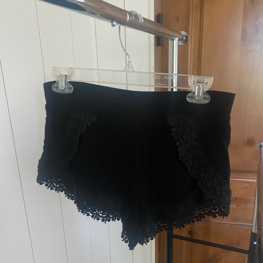 Tillys black flowy shorts with flower detail on edges! Size small